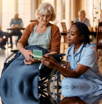 nurse with elder in wheelchair